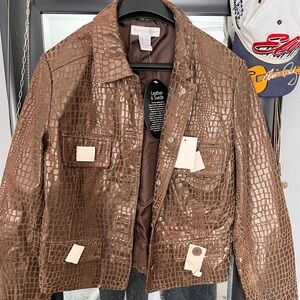 Leather jacket tags and button covers intact 
Size 14
Never worn